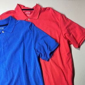 Two St. John’s Bay Pique Men’s Polos, Size L, one blue, one salmon red, 100%cott